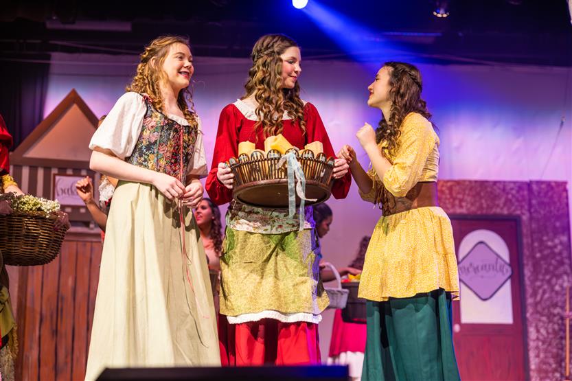 Actors perform onstage